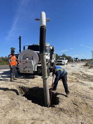 Hydro excavating ground to locate utility lines