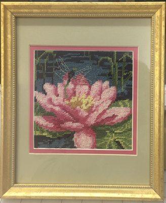 Needlepoint accented with a bright pink and soft green to compliment the design.