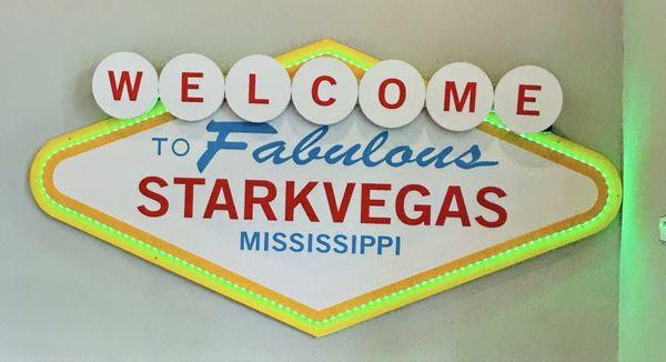 Stark Vegas sign at top of stairs