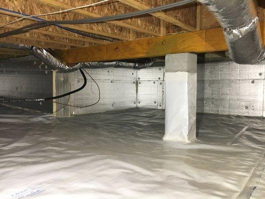 CleanSpace vapor barrier on the crawl space floor and wrapped piers, to keep moisture out.