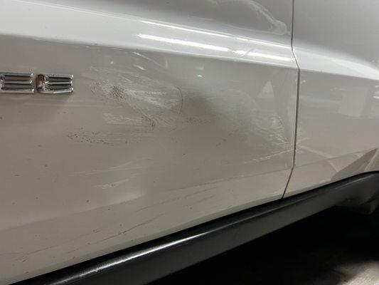 Before repair: dent and scuffs