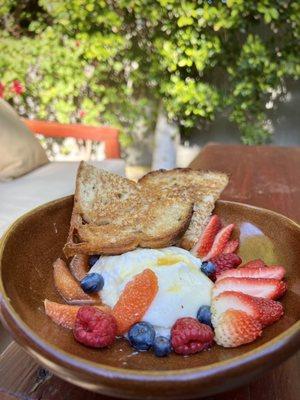 Fresh burrata with local honey, seasonal fruit, & sourdough toast.