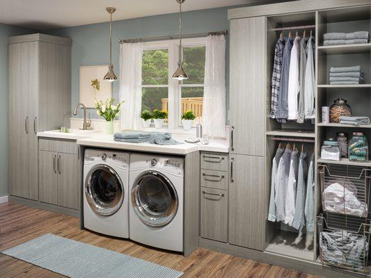 We love this elegant yet functional laundry design! Discover the secret to efficient laundry organization with our custom-designed solutions