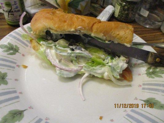 Subway / Airport Drive: The Roasted Chicken Sub, propped open with a steak knife for insppection.