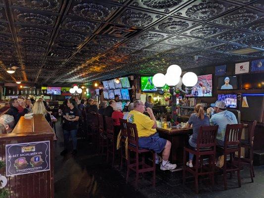 Plenty of bar seating with tons of TVs