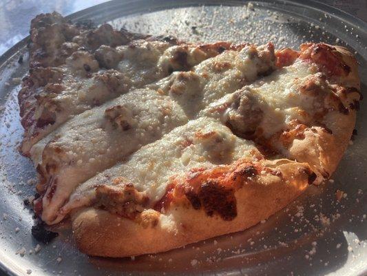 Delicious slice sausage pizza Mama Ciminos approved!