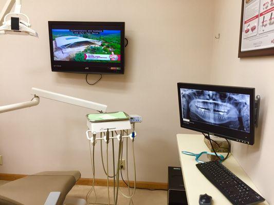 All digital x-rays and a TV to watch in every operatory