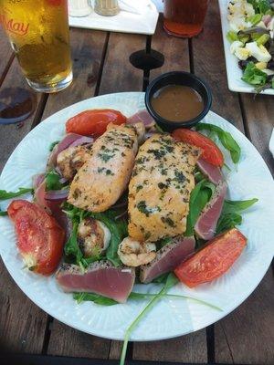 Grilled Salmon salad with the addition of Grilled Shrimp and Ahi Tuna!