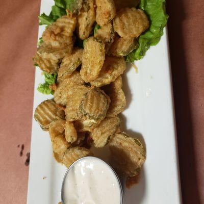 Fried pickles with ranch dressing and Ceasar salad