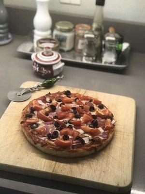 Vicolos crust, Trader Joe's pizza sauce, pepperoni, red onion, mozzarella, kalamata olives. Oven temp 425 for 16 minutes.