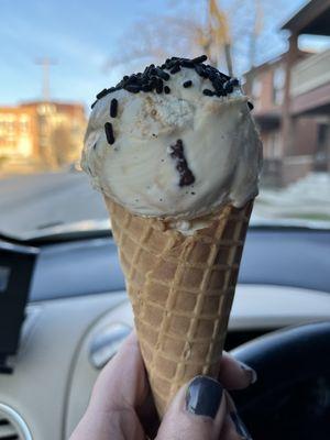 Caramel chocolate pretzel on a waffle cone.