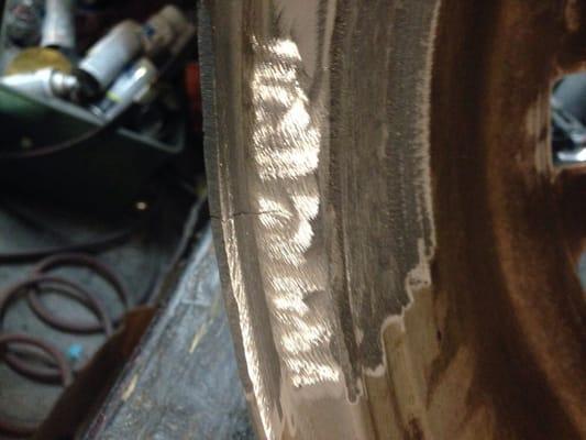 Cracked BMW 750 wheel before weld (surface already prepared for weld)