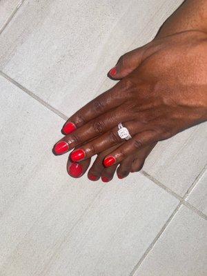 Gel polish on the hands and matching regular polish on the toes