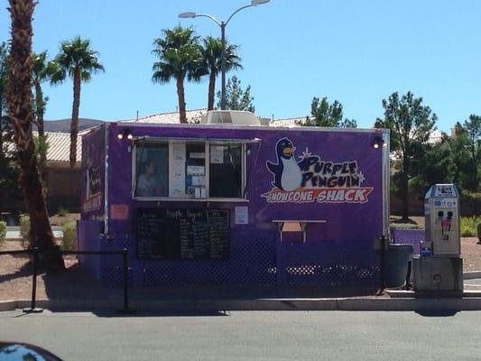 Snowcone shack in front by the pumps.