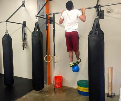 Weighted pull ups using a kettlebell, russian style