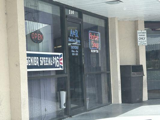 Store front military and Boynton SE corner near bank.