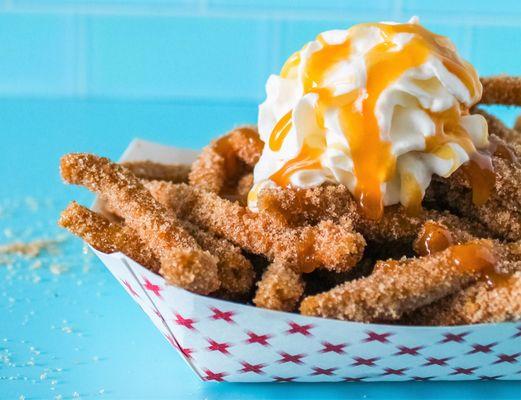 Churro Fries- mini churros fried fresh and topped with a thick homemade cream and drizzled with caramel