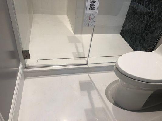 Solid surface flooring and shower