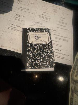 The bill arrives in a little composition book. People leave reviews in them.