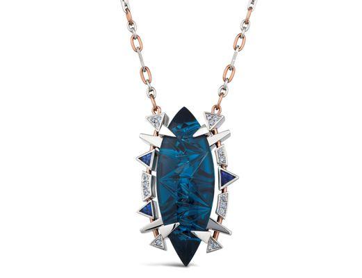 36.55 carat Brazilian-mined London blue topaz, cut by a German master lapidary.  It also features .27tw diamonds and .60tw blue sapphires.