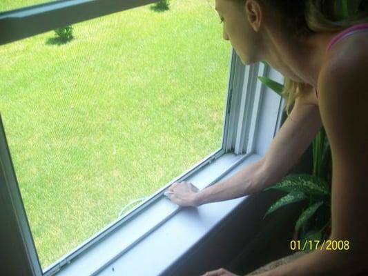 Cleaning a window in Smithfield Rhode Island