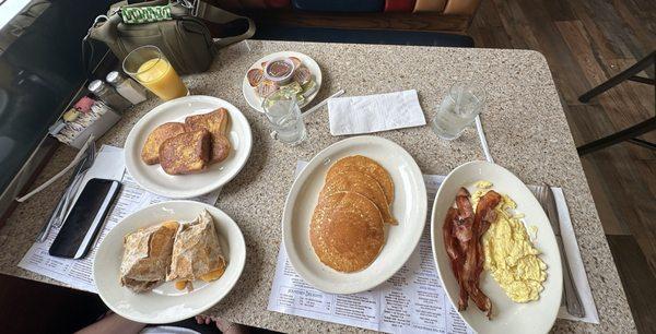 French toast, western avocado wrap, gluten free pancakes, scrambled eggs, and bacon