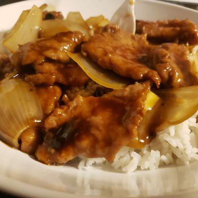 A whole lot of onion in the tough, chewy, and no flavor beef in black bean & garlic sauce dish