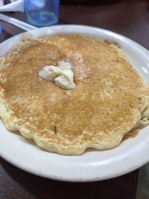 Pancakes that are fluffy and the size of a plate.