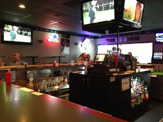 Square bar with plenty of TV screens.