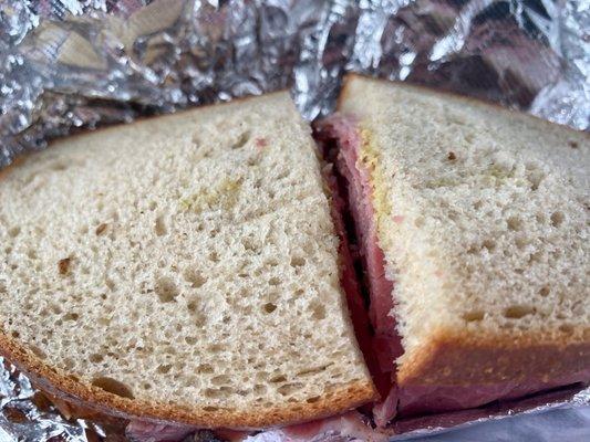 Small pastrami sandwiches not a small price yet get they got bills to pay