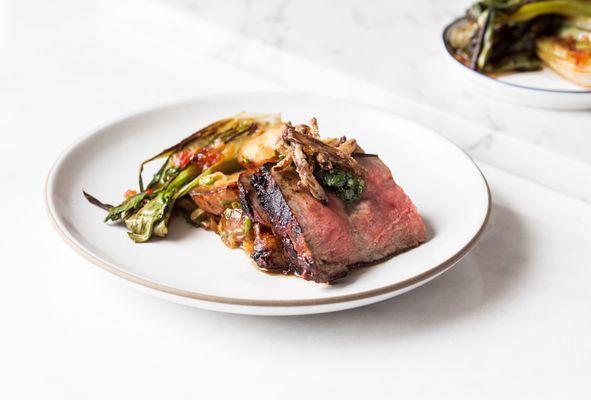 Brisket with roasted seasonal vegetables entrée.