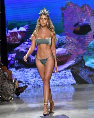 Model Dakota walks the catwalk during swim week 2018 with a Miami Glow Spray Tan