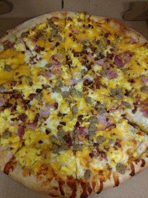 Bacon, egg, ham, and sausage breakfast pizza!!    ...please give 1 day notice for ordering!!