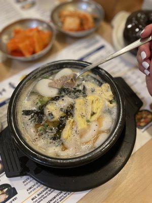 Gomtang ttkeoguk (rice cake soup, lots of meat) and comes with a side of rice