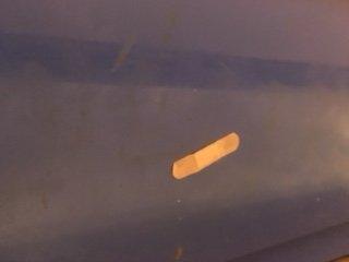 A bandaid stuck to the outside of the tanning bed!!! How NASTY??????