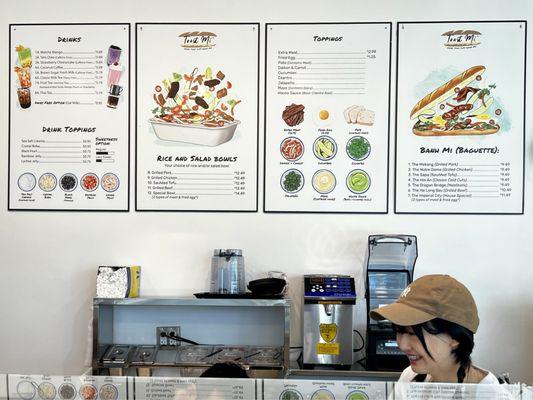 Interior menu and smiling employee.