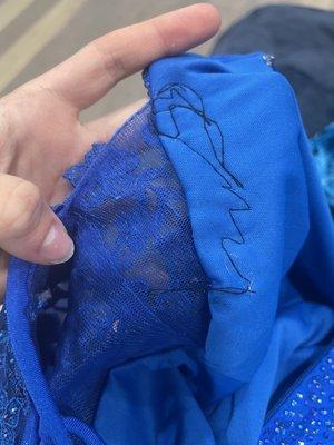 This is the top of the dress which was supposed to be tightened to fit better and it did not bf it properly.