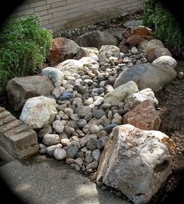 Dry stream beds save water and enhance the landscape