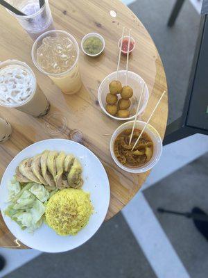 Curry fish balls , Hainan chicken and curry pork skin , accompanied by our pearl and tea drinks