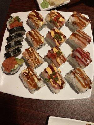 Tiger Roll, 49er roll, cherry blossom roll, & super Spicy Tuna Roll (left to right)