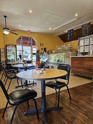 The interior of the restaurant with the entrance in the background.