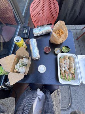 beef barbacoa burrito (top), elote (left), tacos dorados (right)