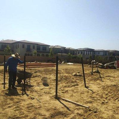 Setting fence post in Pacific Highlands Park.