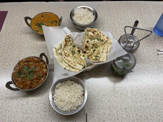 Madras chicken (red), Chicken Tikka Masala (orange), garlic naan, and samosas (not pictured)