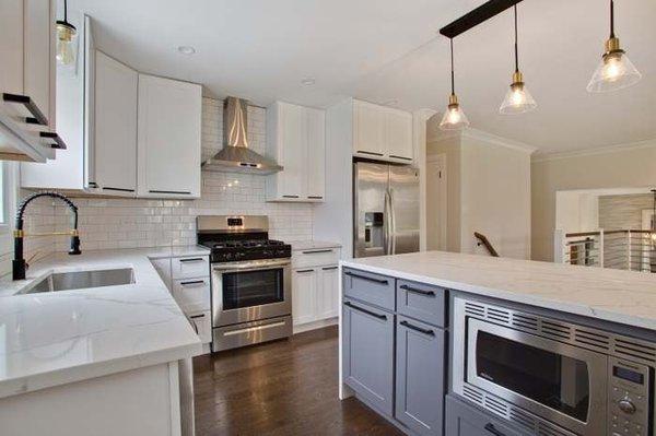 Shaker Grey cabinets paired with Shaker White cabinets and modern marble countertops