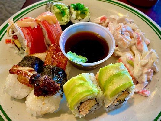 Sushi variety, crab salad and low sodium soy sauce with wasabi