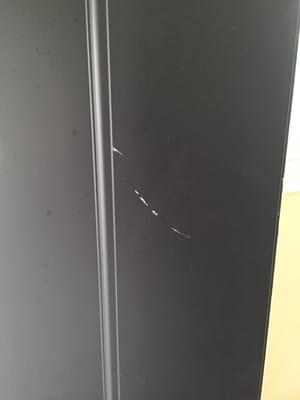 Another door repair and the sub  marks up our front door withe white paint  (notice other marks damaged by other workers)