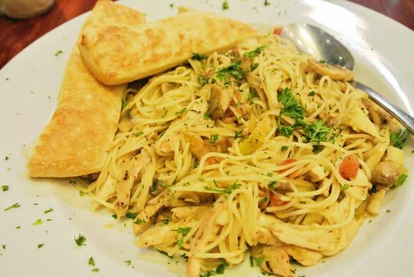 Garlic Chicken - Thin spaghetti and grilled chicken with mushrooms, artichokes, onions, and tomatoes with garlic butter sauce