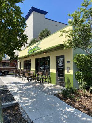 Outside seating, entrance, and food truck