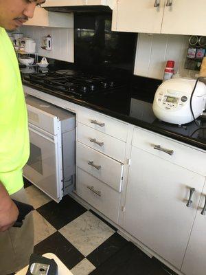 Removing broken oven.